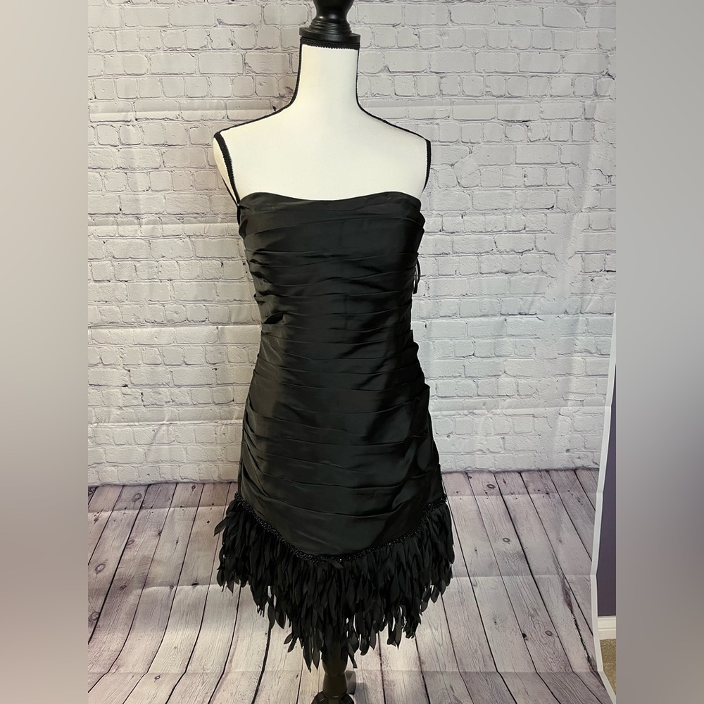 Black formal/party dress with curled fabric at bottom